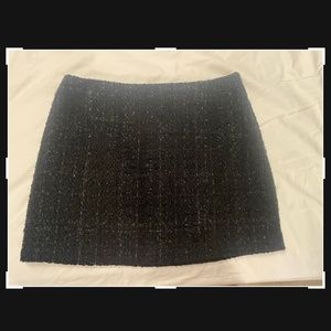 Black woven mini skirt with shiny threads